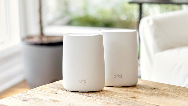 Orbi RBK50 Wooden Table Lifestyle 3- scaled-16x9.jpg